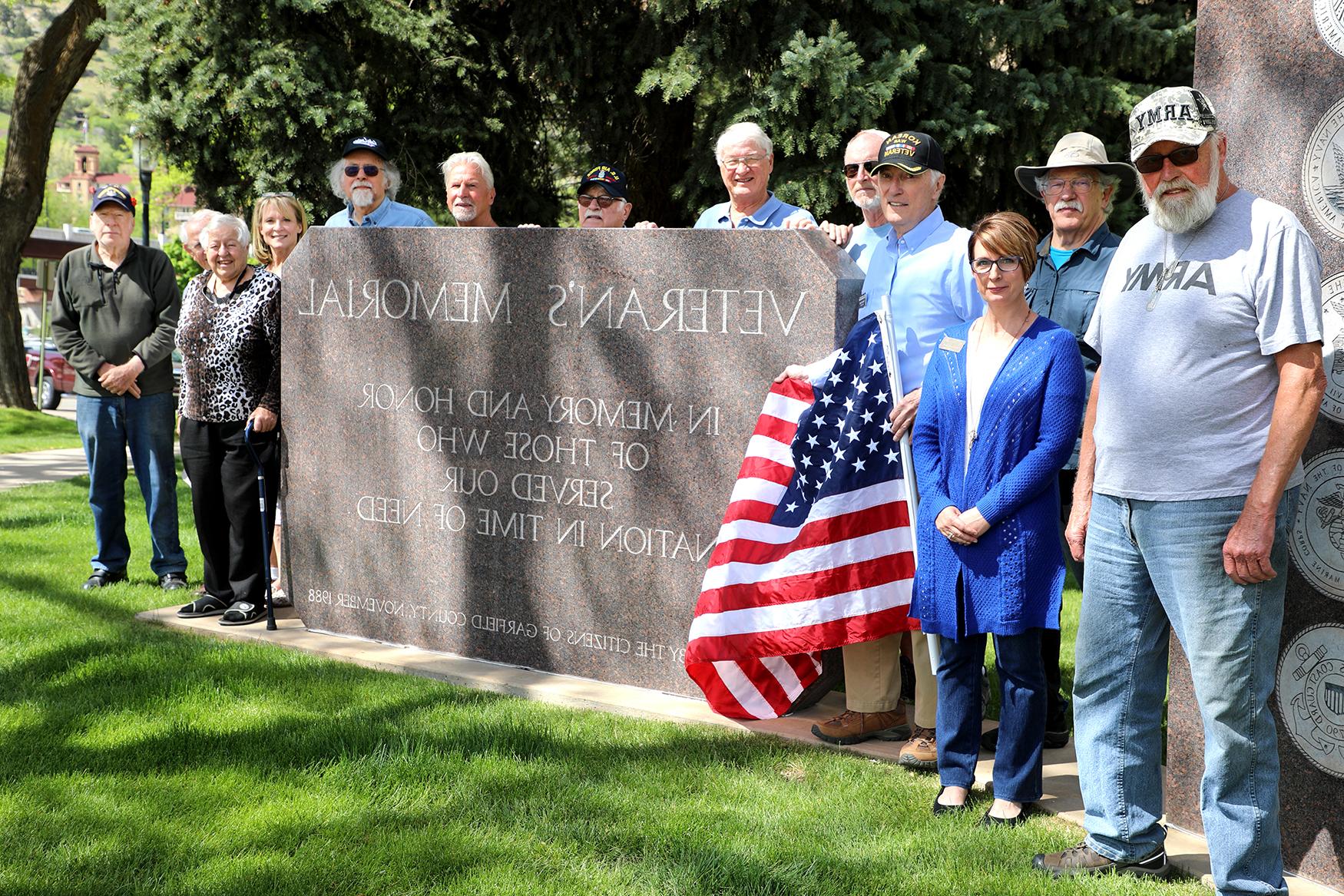 Veterans pose next to the Veteran's Memorial in Glenwood Springs, Colo., on Armed Forces Day 2019.